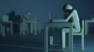 Plastic figure resembling a human who sits on a table infront of a laptop in a dark room. Long shadows disseminate a gloomy mood.